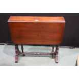 Edwardian mahogany Sutherland table, with two drop leaves, on ring turned legs and stretchers,