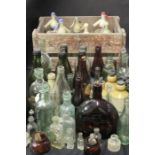 Collection of bottles, jugs, taps soda water bottles and a Schweppes grate