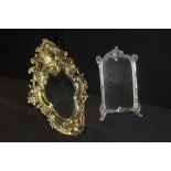 Brass dressing table mirror, the bevelled mirror plate housed in a pierced scroll decorated easel