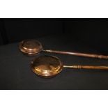 Two copper warming pans with turned wooden handles (2)