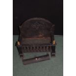 Cast iron fire basket, the arched back with fruiting vine and scroll decoration, 48cm wide