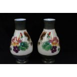 Pair of Edwardian painted glass mantel vases, with floral decoration, 31cm high