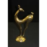 Brass figure depicting a stylised deer, 43.5cm high