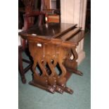 Nest of three oak occasional tables, the rectangular tops raised on pierced end supports and