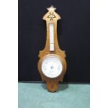 Art Nouveau style oak barometer/thermometer, with retailer name to dial W.S. Cowell Ltd. Ipswich,