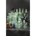 Collection of glass bottles, some with manufacturers names, (qty)