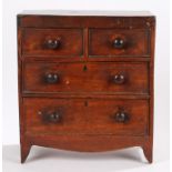 Victorian miniature mahogany chest of drawers, the rectangular top above two short and two long