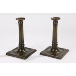 Pair of Lloyds Coffee House brass candlesticks, circa 1760, the sticks heavily cast in brass with