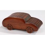 Novelty mahogany cigarette case and vesta in the form of a car, with two tambour lidded