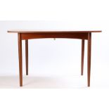 G-plan teak dining table, the top with rounded corners, internal cantilever leaf, raised on turned