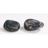 Two glass pebbles, with swirled decoration, the largest 7cm wide (2)