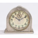 Early 20th Century Westclox alarm clock, the reeded arched case on a plinth base, the dial with