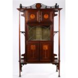 Liberty style Art Nouveau display cabinet, the sweeping pierced three-quarter galleried top with