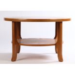 Mid 20th century teak circular coffee table, the top with carved decoration, on shaped legs united