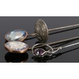 Charles Horner silver hat pin, Chester 1890, of twisted loop form set with an amethyst type stone,