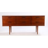 Mid 20th Century teak chest of six drawers, raised on turned tapering legs, 145cm wide