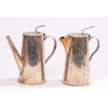 Asprey silver plated coffee pot and hot water jug, the lids with curved handles above tapering