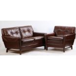 Late 20th Century two seat settee and matching armchair, upholstered in brown leather, raised on
