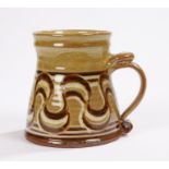 Studio Pottery mug, decorated with a yellow/brown glaze and swirl lines, impressed mark to the base,