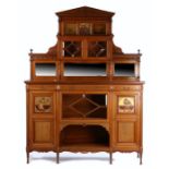 Aesthetic Period cabinet, the triangular pediment with carved swag decoration above a dentil and