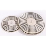 Hans Hansen Danish silver coasters, of circular form with reeded decoration, 10cm and 7cm