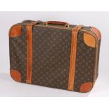 Louis Vuitton style suitcase, the brown leather exterior with LV monogram and stylised geometric