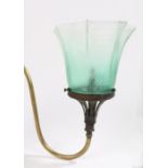 Early 20th Century gas wall light, the scrolled brass arm housing the green and frosted glass