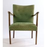 Mid 20th Century armchair, upholstered in a green patterned material, with show wood arms, raised on