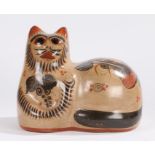Pottery model depicting a cat, with stylised leaf, bird and scroll decoration, 29cm high, 35cm wide