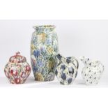 Pottery vase, two jugs and vase & cover, all with stylised floral decoration the tallest 53cm (4)