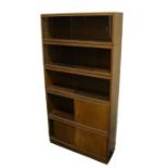 Simplex sectional bookcase, formed from five sections with sliding wooden and glass doors, 91.5cm