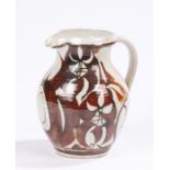 Art Pottery jug by Alan Caiger-Smith (B1930), the off white ground with brown stylised foliate