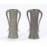 Pair of Art Nouveau pewter vases, by A.M. & Co, the wasted beaten bodies with tapering curved