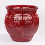 Large Arts and Crafts red glazed hexagonal jardiniere, possibly Burmantofts, the body with scale and