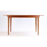 1970's teak extending dining table by A H McIntosh & Co. Kirkcaldy Scotland, with internal