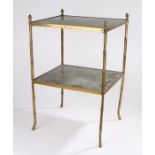 Brass two tier occasional table, with pineapple finials above a tooled leather top and undertier,