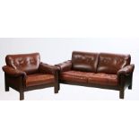 1970's two seat settee and matching armchair, upholstered in brown leather with buttoned decoration,