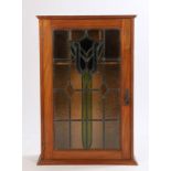 Art Nouveau wall cabinet, the stained glass door with stylised foliate decoration, 53cm wide