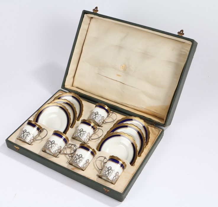 Set of six Aynsley coffee cups and saucers, the silver frames Birmingham 1917, maker Philip Hanson