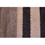 Contemporary rug, with dotted bands of black to cream, 185cm x 127cm