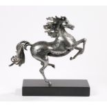 Contemporary metal scuplture depicting a rearing horse, on a black rectangular plinth base, 30.5cm