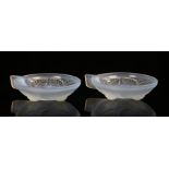 Pair of Lalique style opalescent glass dishes, with stepped Art Deco style handles and leaf