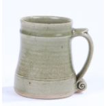 Bernard Leach pottery tankard, with scroll handle, 12cm high