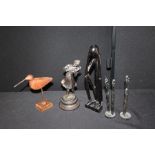 Spelter figure of a young girl playing the violin, African carving of a seated figure, two African