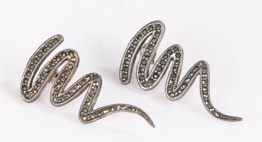 Pair of silver and steel cut earrings in snake form