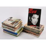 A large collection of Elvis Presley books & magazines.