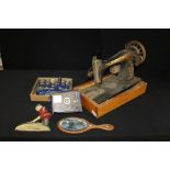 Novelty iron door stop as a golfer together with telegraph morse code, hand mirror, Singer sewing