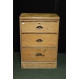 Pine chest of three long drawers, with scroll cast cup handles, on a plinth base, 64cm wide