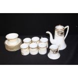 Noritake 'mosq' pattern ornate tea set, overlaid gilding on a white and cream background.