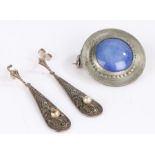 Art Nouveau white metal and blue stone brooch the circular stone set in a circular disc 2.75 cm